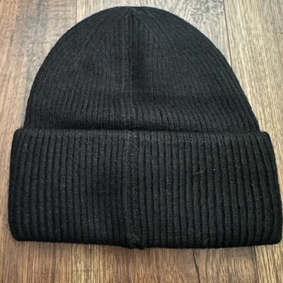 Prada Knit Ribbed Beanie in black with silver logo